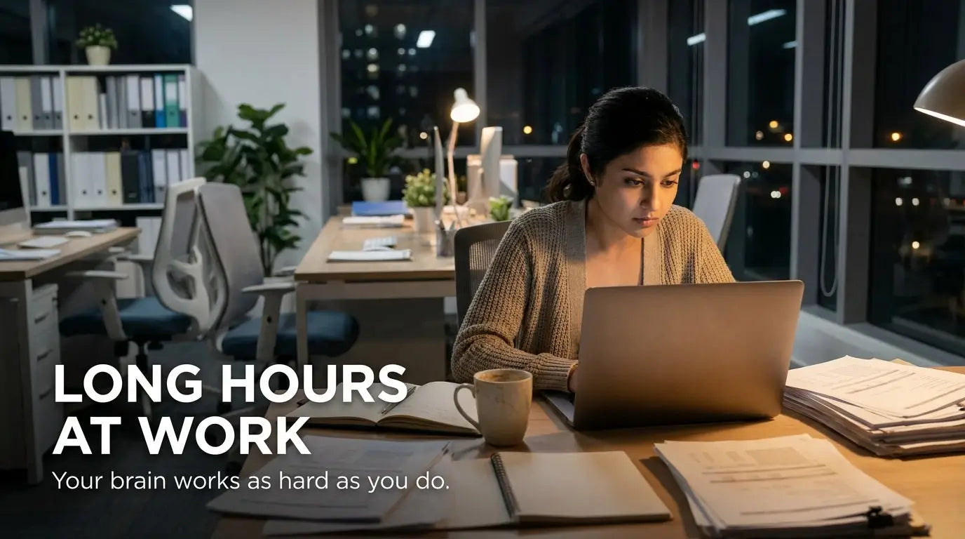 Young woman working late at her desk
